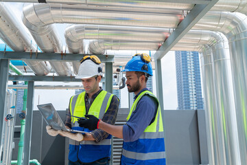 Engineers Collaborating and Smiling in Industrial Setting