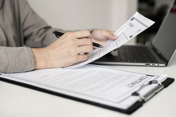 Business woman employer holding resume hiring recruit looking cv resume to hire candidates,...