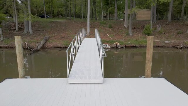 Empty boat dock on the lake. Dolly back over the water. Lake Murray in South Carolina.