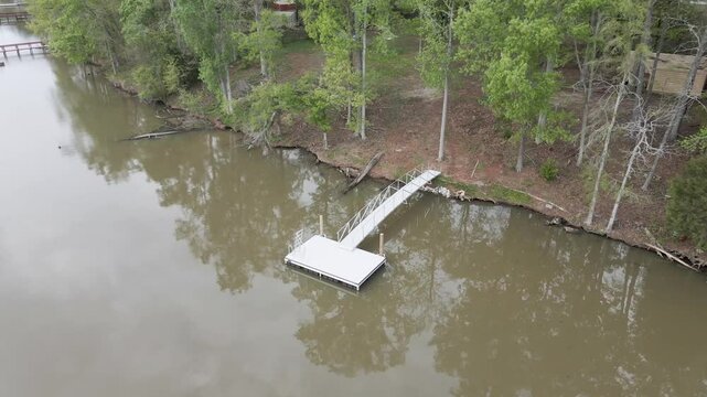 Empty boat dock on the lake. Zoom out shot to reveal the whole lake. Lake Murray, South Carolina.