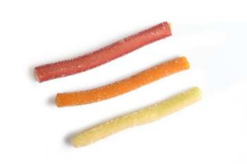 fruit licorice sticks on white background
