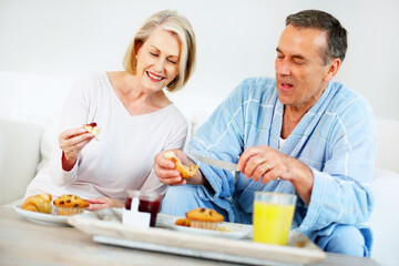Senior couple, bedroom and food for nutrition, breakfast and wellness for retirement health. Mature woman, man and croissant or muffin with fruit jam for diet, romance and elderly care or support