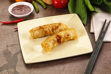 Vietnamese stuffed spring roll served sauce