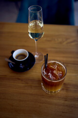 espresso coffee and sparkling wine, prosecco and bumble ice coffee with orange on the table