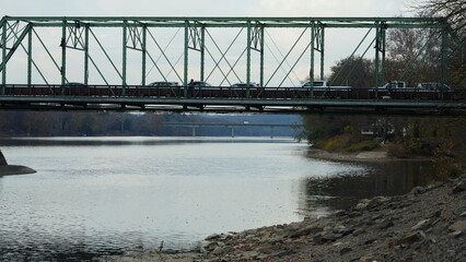 Naklejka premium One old rion frames bridge view on the river with the sunset sky as background