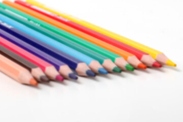 blurry looking, colored pencils isolated on white background