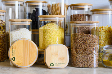 Eco-friendly reusable tableware for storing food in a modern kitchen, zero waste. Two wooden lids...
