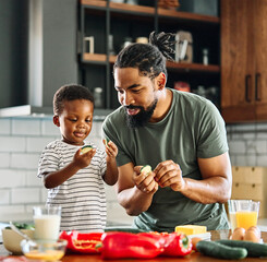 child family kitchen food boy son father meal fun preparing healthy diet eating home black african american man happy ingredient having fun game joy bonding kid cute