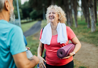 woman man couple happy mature together active fit fitness park outdoor healthy talking leisure park...