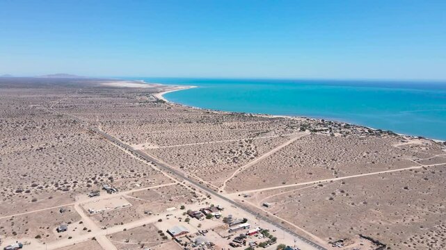 Aerial view of Baja California's vast coastline overlooking the bright blue colored ocean, Ejido Delicias
