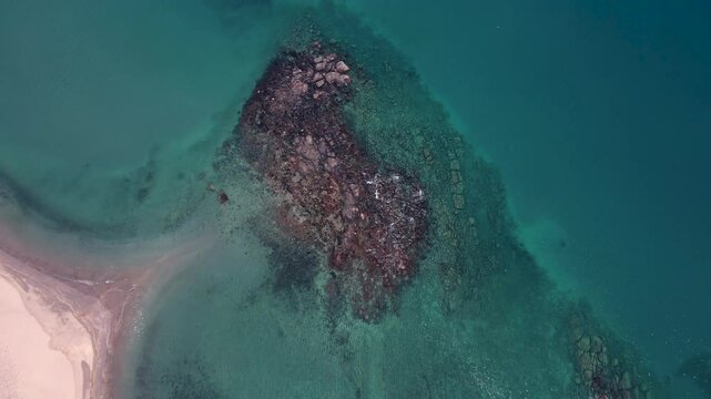aerial view rotating around a big pile of boiler rocks
