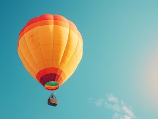 Naklejka premium Vibrant Hot Air Balloon Lifting Off into Clear Blue Sky Representing Freedom and Adventure