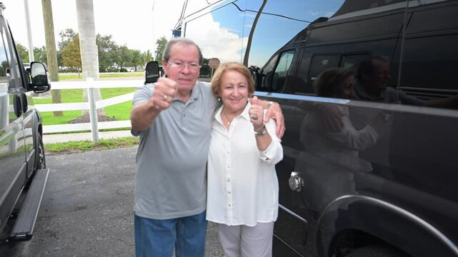 two rv camper van buyers happy with the selection of small recreational vehicles on the lot