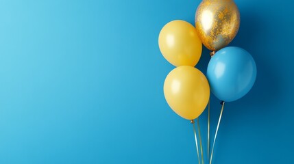 Blue and yellow balloons on a blue background with copy space for text.