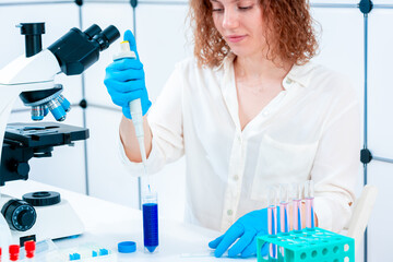 Scientist Pipetting in Laboratory