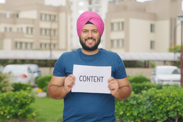 Sikh Indian Man Holding Content Poster