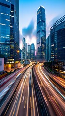 Obraz premium light trails of cars moving fast on the highway with skyscrapers