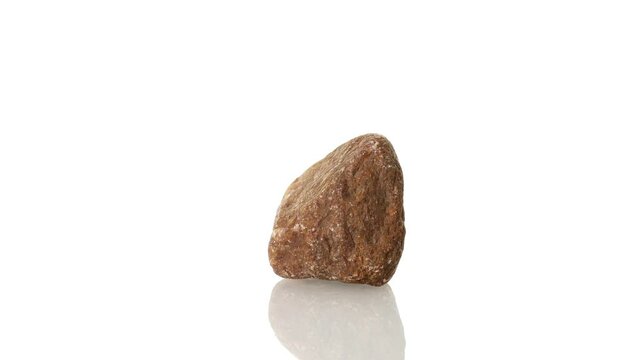 Spinel mineral stone spinning in a circle on a white background