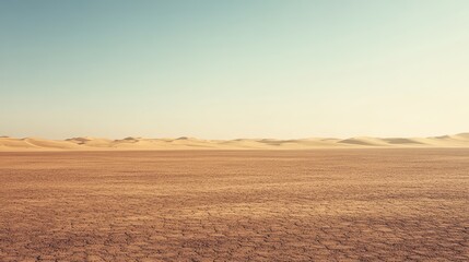 Fototapeta premium Photograph of a vast, empty desert with distant echoes of dunes and a horizon that fades into infinity.