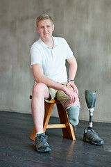 Man, portrait and amputee with prosthetic leg, sitting and residual limb or assemble. Gym workout,...