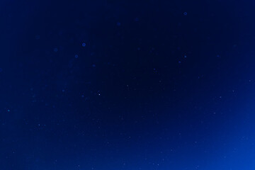 A tranquil night sky filled with numerous stars, showcasing the beauty of the cosmos. The deep blue background highlights faint constellations and the vastness of space.