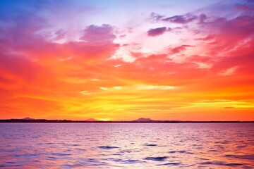 Stunning Sunset Over the Ocean with Dramatic Sky and Water Reflections