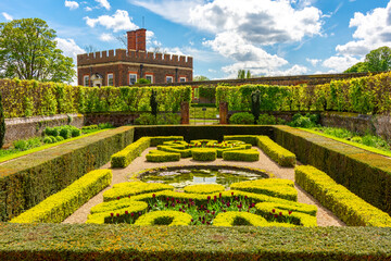 Little banqueting house in Privy gardens of Hampton Court palace in spring, London, UK