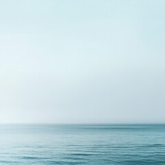 Fototapeta premium Serene Beach Scene in Mist, Perfect for Calm and Tranquil Themes, Generous Copyspace