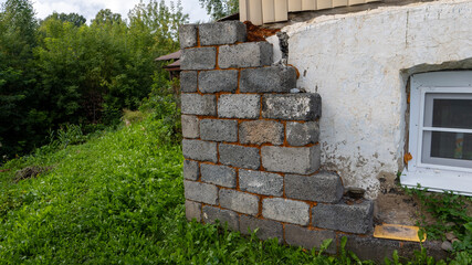 A brick wall with a window in the back