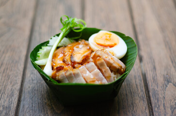 Barbecued red pork in sauce with rice