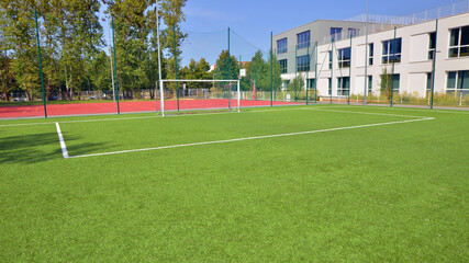 Artificial turf football pitch near school. 