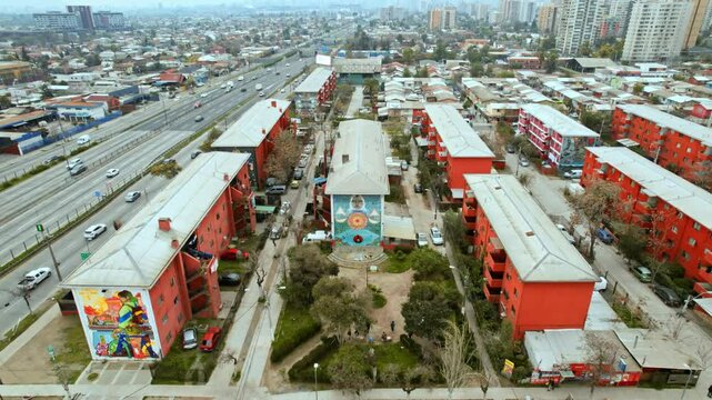 Cityscape of Santiago de Chile suburbs aerial fly residential Area, Highway and Museum, south american capital city, establishing shot of San Miguel Museum