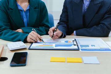 A busy office environment where teams collaborate on creative projects, finance, and marketing strategies using data, charts, and reports, engaging in brainstorming and training sessions to achieve bu