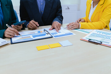 A busy office environment where teams collaborate on creative projects, finance, and marketing strategies using data, charts, and reports, engaging in brainstorming and training sessions to achieve bu