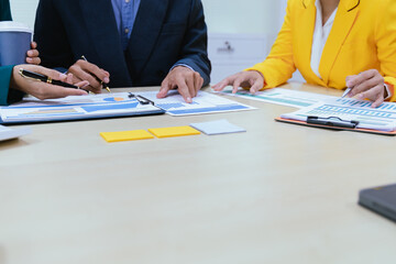 A busy office environment where teams collaborate on creative projects, finance, and marketing strategies using data, charts, and reports, engaging in brainstorming and training sessions to achieve bu