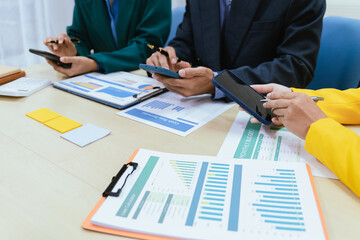 A busy office environment where teams collaborate on creative projects, finance, and marketing strategies using data, charts, and reports, engaging in brainstorming and training sessions to achieve bu