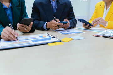 A busy office environment where teams collaborate on creative projects, finance, and marketing strategies using data, charts, and reports, engaging in brainstorming and training sessions to achieve bu