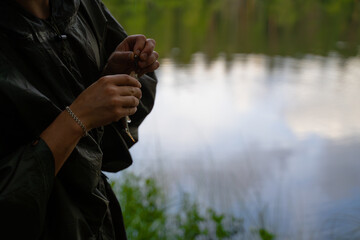 Lonely man fishing in the forest