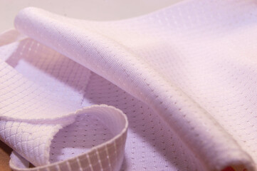 close up texture of jersey fabric with drop needle motif