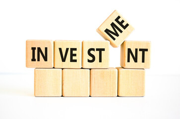 Investment symbol. Concept word Investment on beautiful wooden blocks. Beautiful white background. Business investment concept. Copy space.