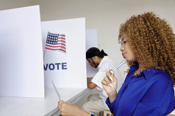 Young woman looking at bulletin and choosing candidate to vote