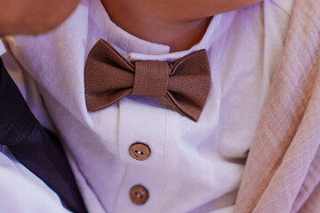 Bow tie on a little boy's shirt. accessories for children's elegant clothes.