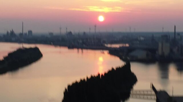 drone flies above river Weser in Bremen in to sunset 