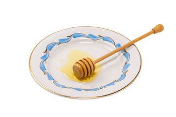 Beautiful plate with wooden spoon for honey isolated on transparent background.