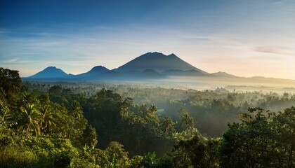 In the early morning hours of Bali island, a landscape of forests and mountains is seen, a scene of nature and travel