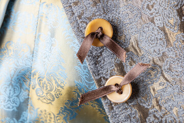Textile luxury background velour, silk and buttons with bows