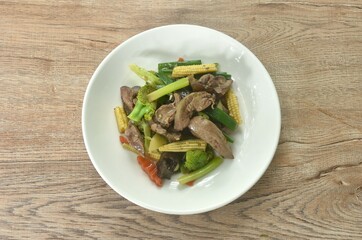 stir fried mixed vegetable with chicken liver and gizzard on plate  