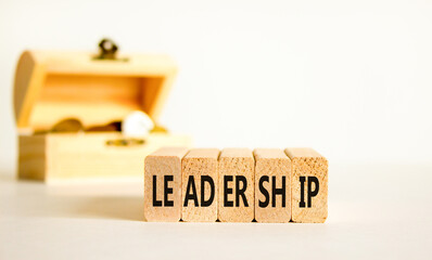 Leadership symbol. Concept word Leadership on beautiful wooden blocks. Beautiful white background. Beautiful wooden chest with coins. Business leadership concept. Copy space.