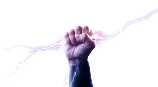 Raised fist holding up a lightning bolt. Isolated transparent background PNG cutout. Zeus the god of thunder and lightning. Raised hand holding a energy electricity lightning bolt.