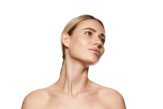 Success of effective skincare. Portrait of attractive young woman demonstrating perfect face, cheekbones and and neck. Concept of beauty, plastic surgery, face lifting, face building